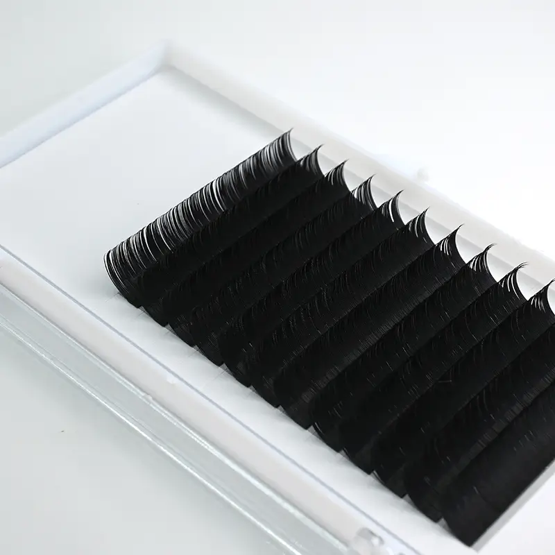 A close-up view of the 0.15 Curl Eyelash Extensions displayed in a pristine white tray, emphasizing the uniformity and precision of the lashes.